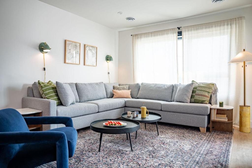 a living room with a couch and a table at Cabot Views by Revelstoke Vacations in Revelstoke