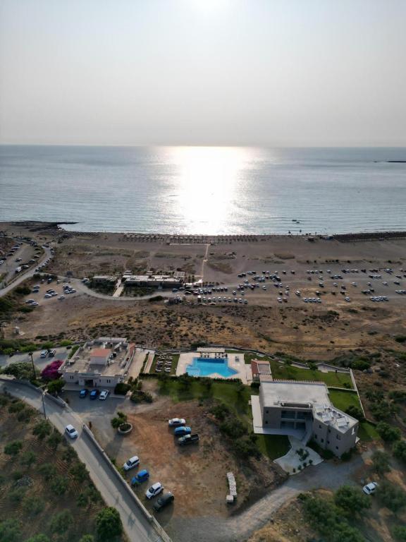 an aerial view of a parking lot next to the ocean at Panorama Hotel in Falasarna