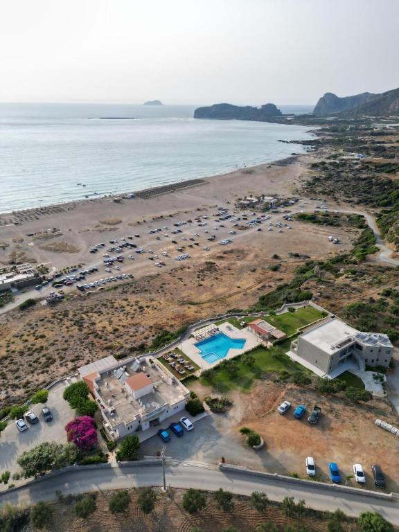 an aerial view of a beach with cars parked at Panorama Hotel in Falasarna