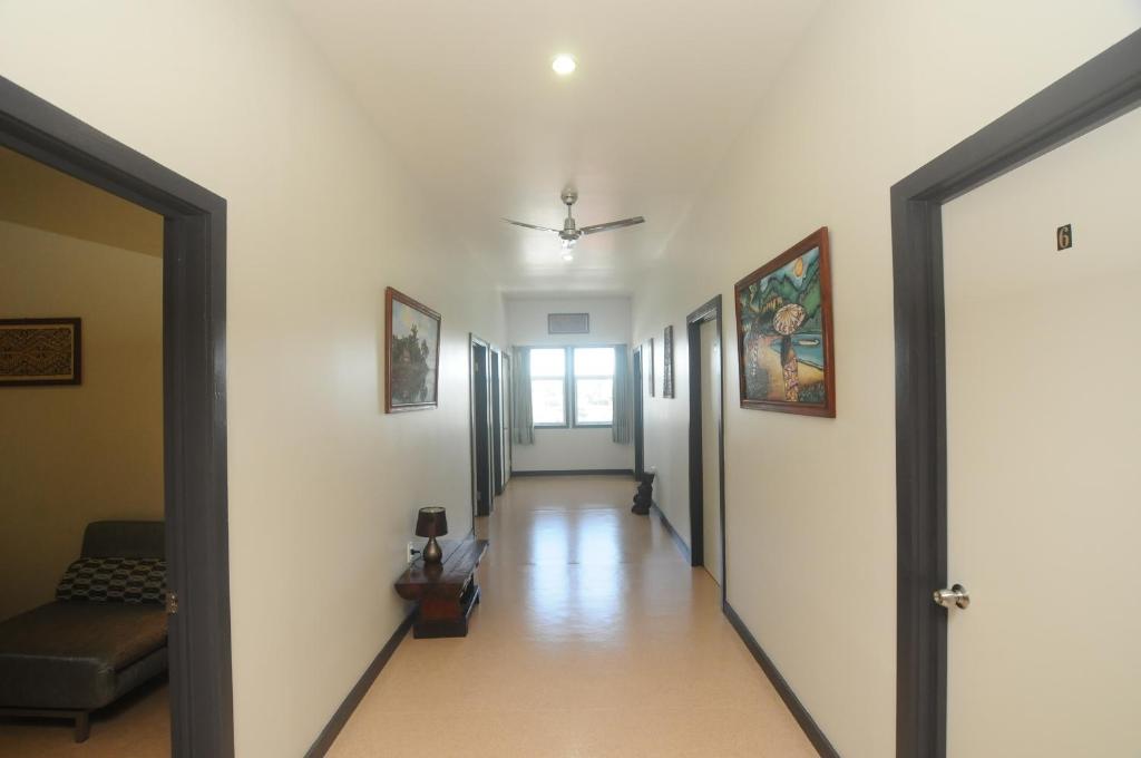 a hallway with a hallway leading to a room at Talofa Inn in Apia