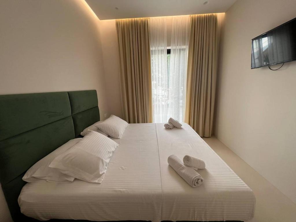 Postel nebo postele na pokoji v ubytování Mare Rooms Vlore