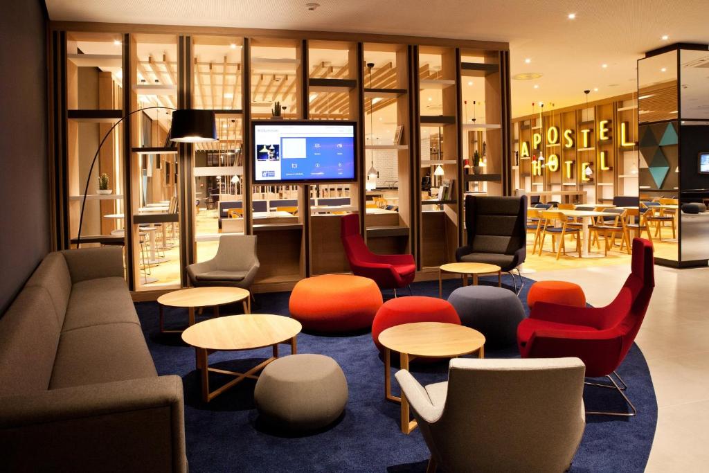 a lobby of a store with colorful chairs and tables at Holiday Inn Express Bochum, an IHG Hotel in Bochum