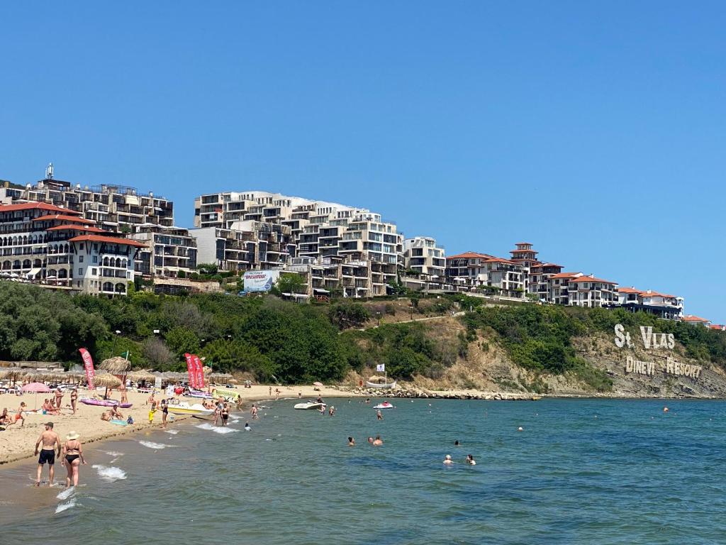 a group of people on a beach in the water at FREGATA 2 Studio Sveti Vlas in Sveti Vlas