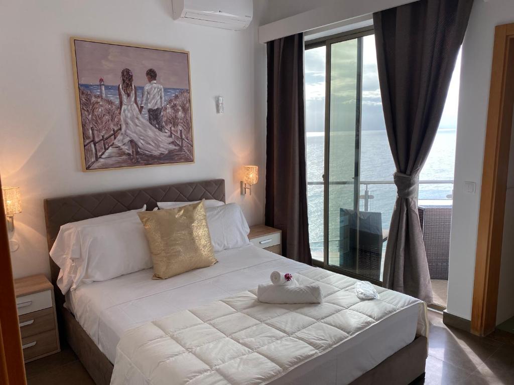 Postel nebo postele na pokoji v ubytování Fogo Boutique Hotel