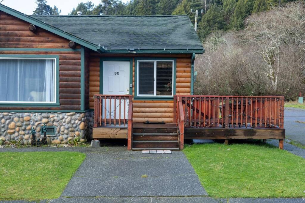 a log cabin with two decks and a door at Elk Meadow Cabins 19B Johnny Redwood - Single Room in Orick
