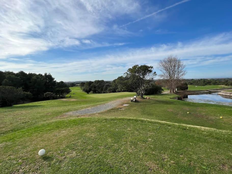 a golf course with a golf ball on the grass at App Le Golf T3 terrasse wifi pkg in Béziers
