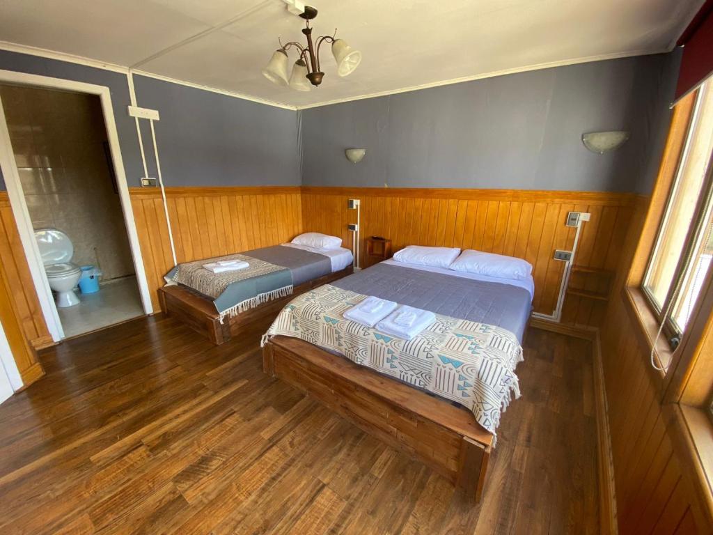 Postel nebo postele na pokoji v ubytování Hostal Ochen