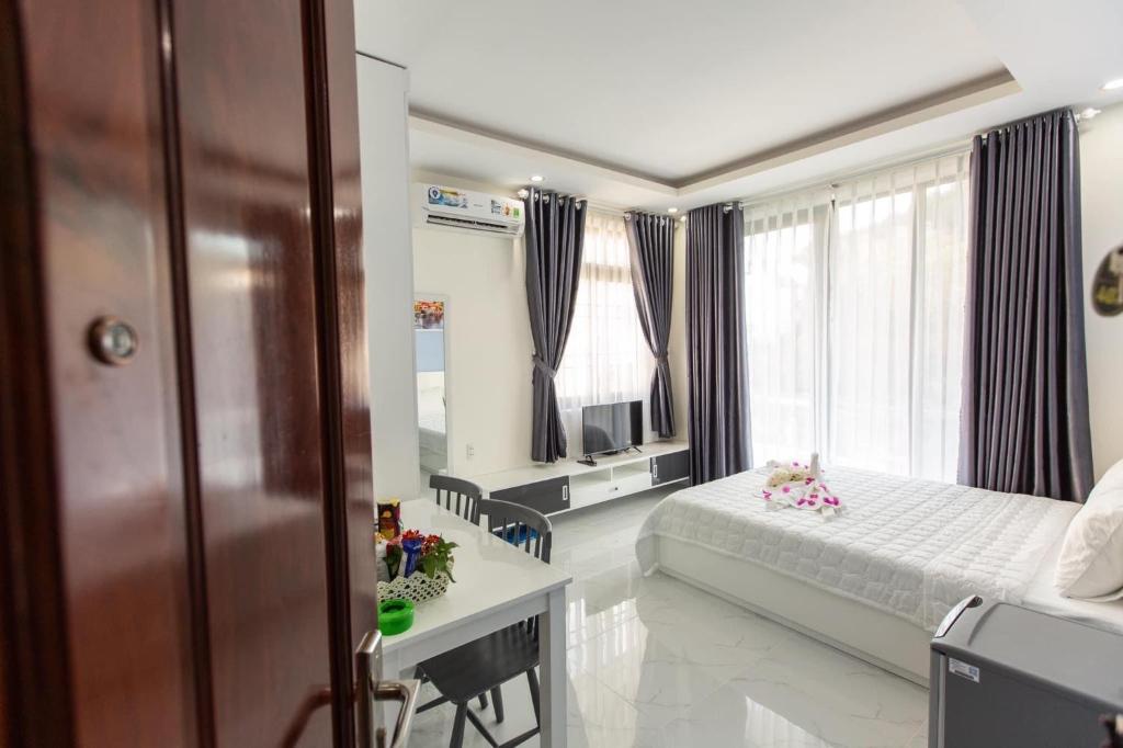 Postel nebo postele na pokoji v ubytování HOTEL & APARTMENT VY VAN