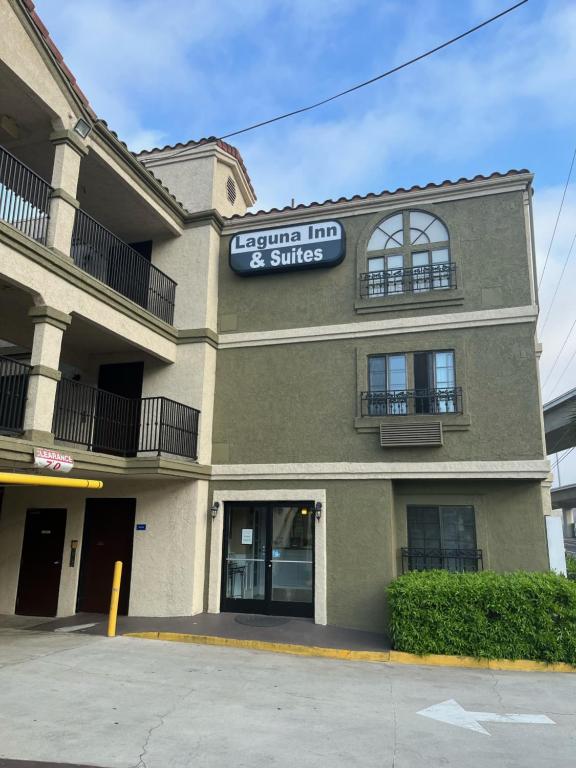 a building with a sign that reads edmonton inn and suites at Laguna Inn and Suites in San Juan Capistrano