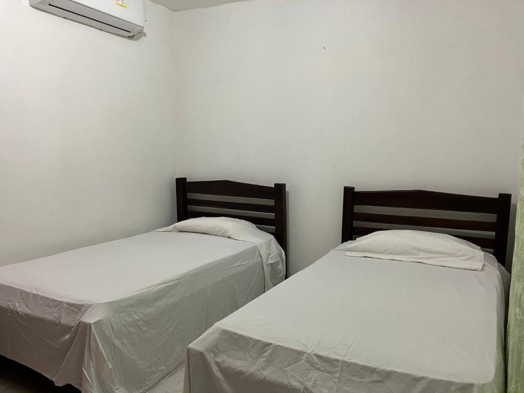 Postel nebo postele na pokoji v ubytování Casa Encanto Cartagena Colombia