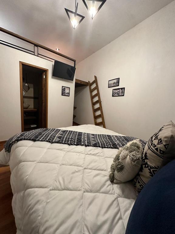 Postel nebo postele na pokoji v ubytování Hotel Kali
