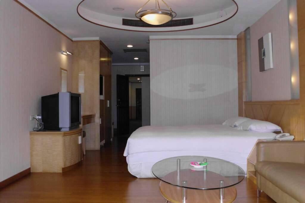 Ένα ή περισσότερα κρεβάτια σε δωμάτιο στο Jia Yun Business Hotel