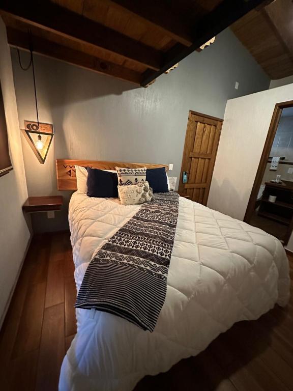 Postel nebo postele na pokoji v ubytování Hotel Kali