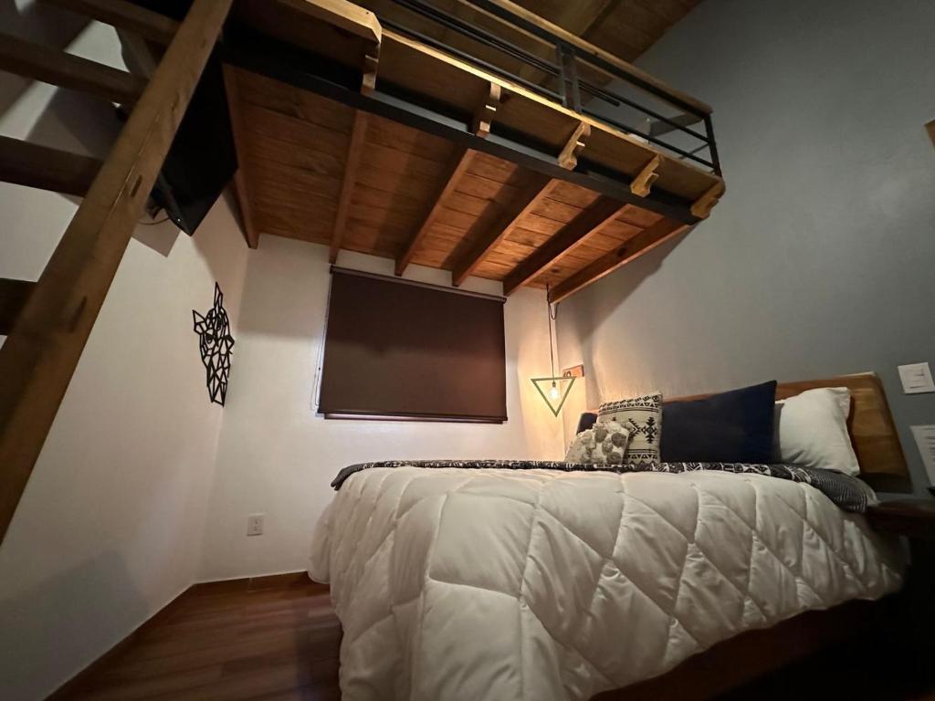 Postel nebo postele na pokoji v ubytování Hotel Kali