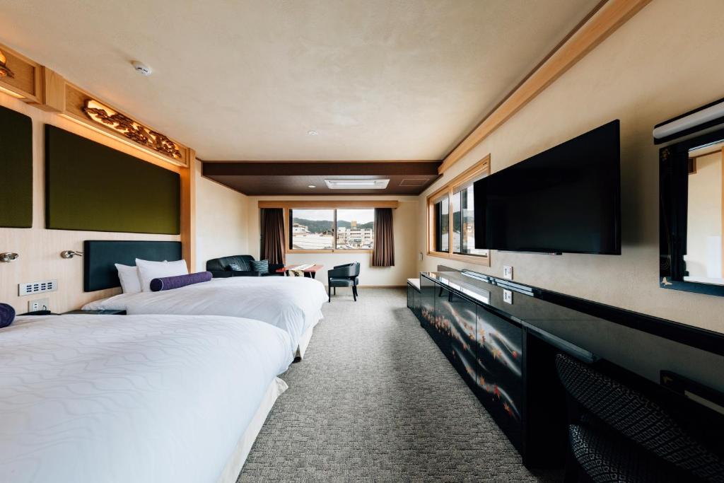 Postel nebo postele na pokoji v ubytování Hotel Alza Kyoto