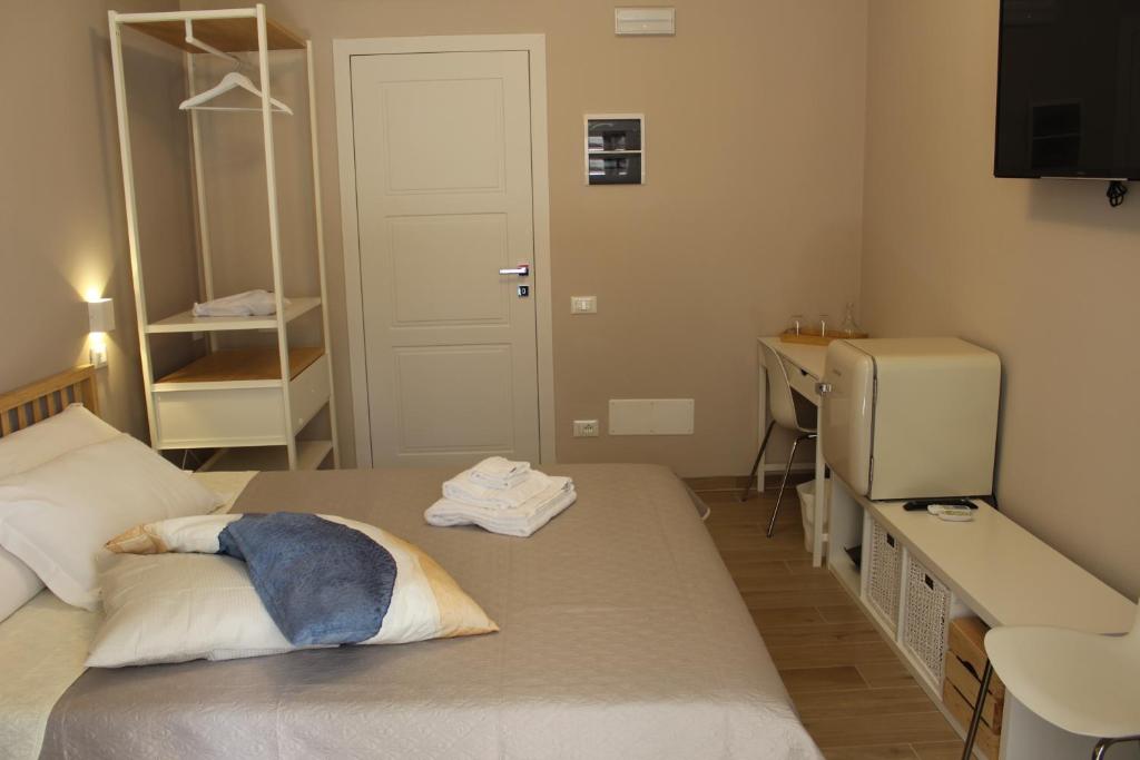 Postel nebo postele na pokoji v ubytování Aurora BnB