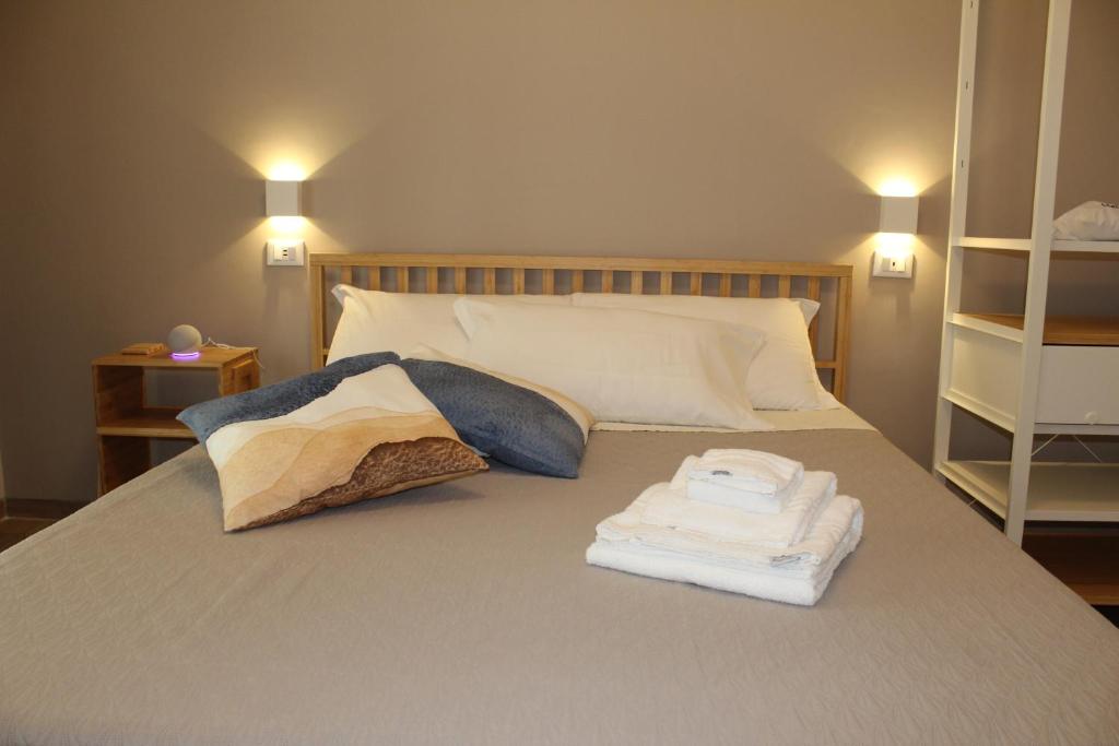 Postel nebo postele na pokoji v ubytování Aurora BnB