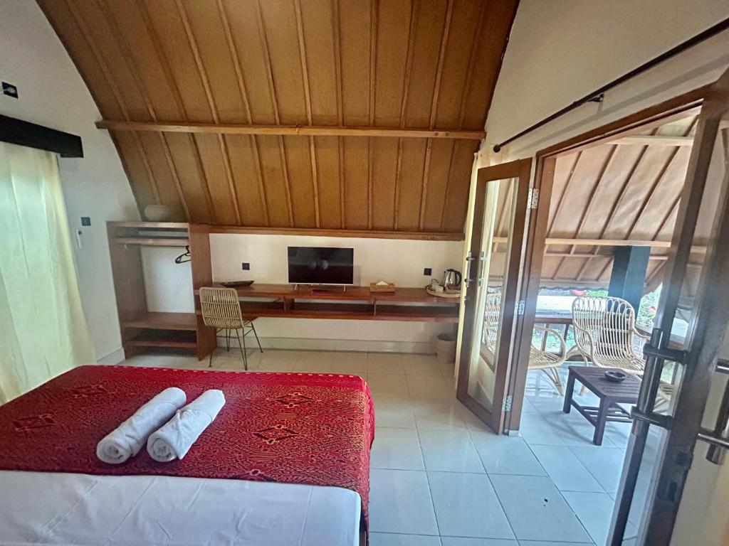 Postel nebo postele na pokoji v ubytování Gili Land