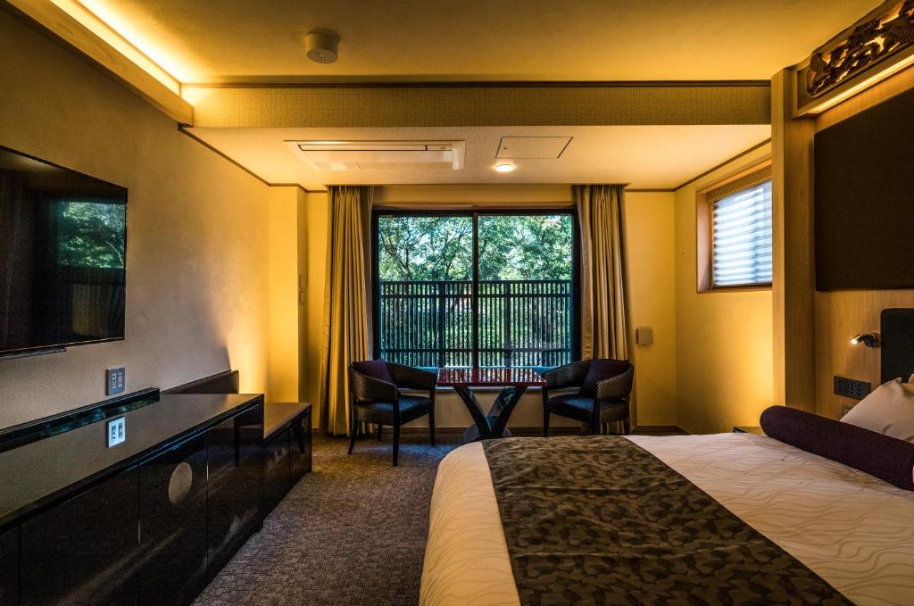 Postel nebo postele na pokoji v ubytování Hotel Alza Kyoto