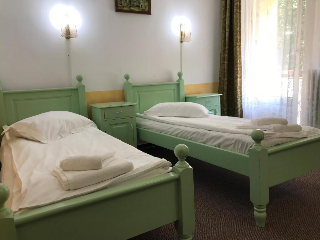 Postel nebo postele na pokoji v ubytování Hotel Hefaistos - Sovata