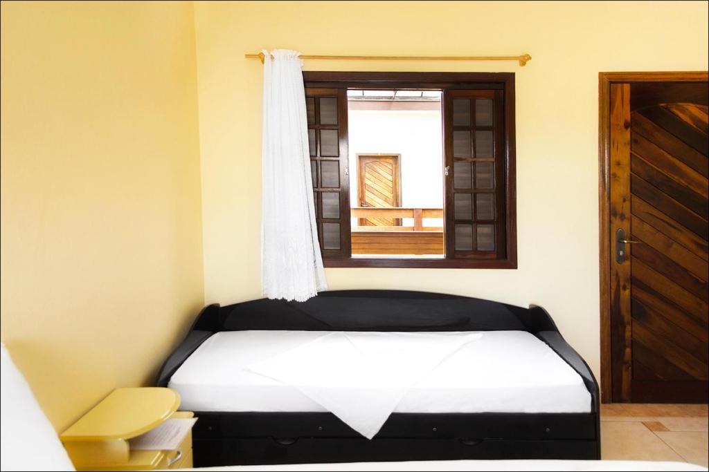 Cama o camas de una habitación en Pousada Solarium UNIDADE 1 ECONOMICA-BÁSICA