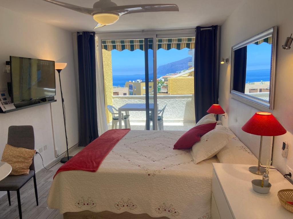 A bed or beds in a room at Estudio Vistamar La Arena