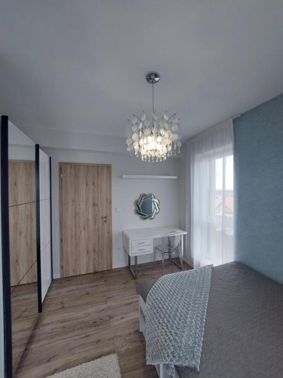 Łóżko lub łóżka w pokoju w obiekcie Paskom Apartmanház