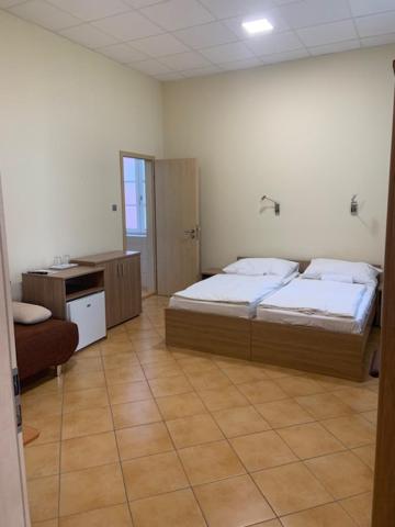Postel nebo postele na pokoji v ubytování BF Hotel