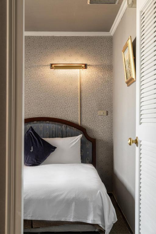Postel nebo postele na pokoji v ubytování Hotel j-Metropolis
