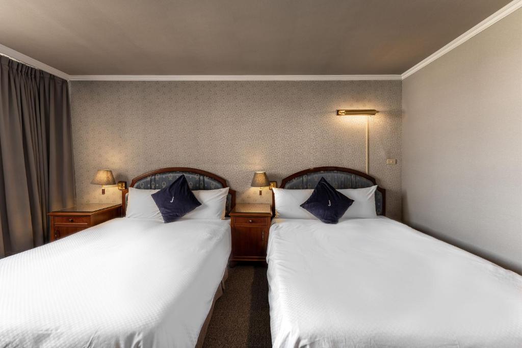 Postel nebo postele na pokoji v ubytování Hotel j-Metropolis