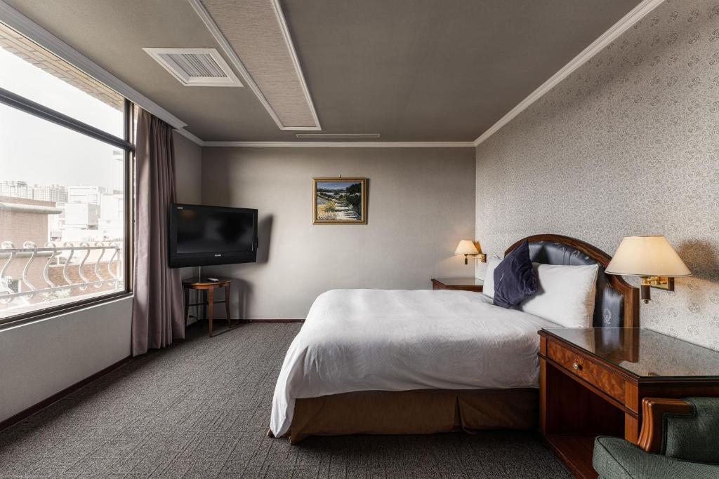 Postel nebo postele na pokoji v ubytování Hotel j-Metropolis