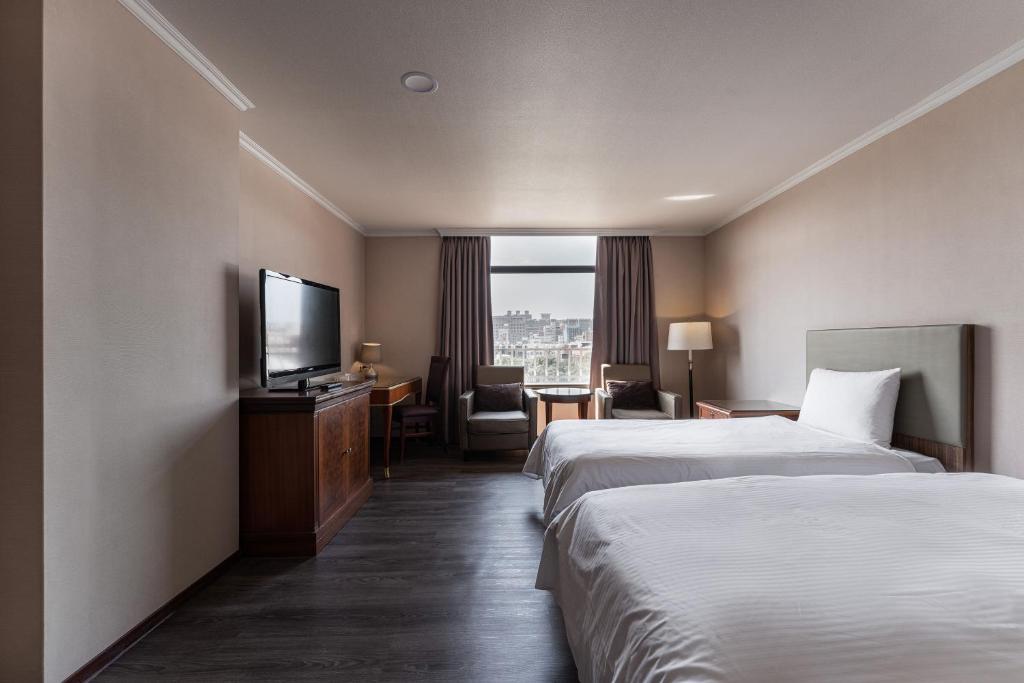 Postel nebo postele na pokoji v ubytování Hotel j-Metropolis