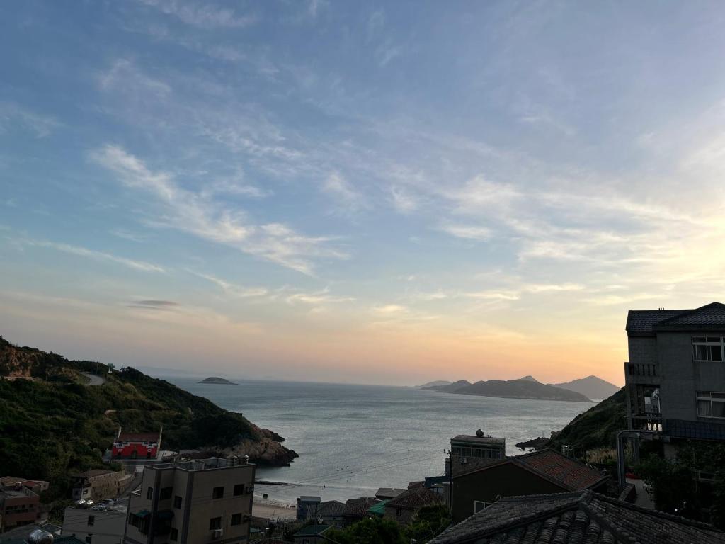 a view of the ocean from a city at 富喜民宿二館 in Nangan