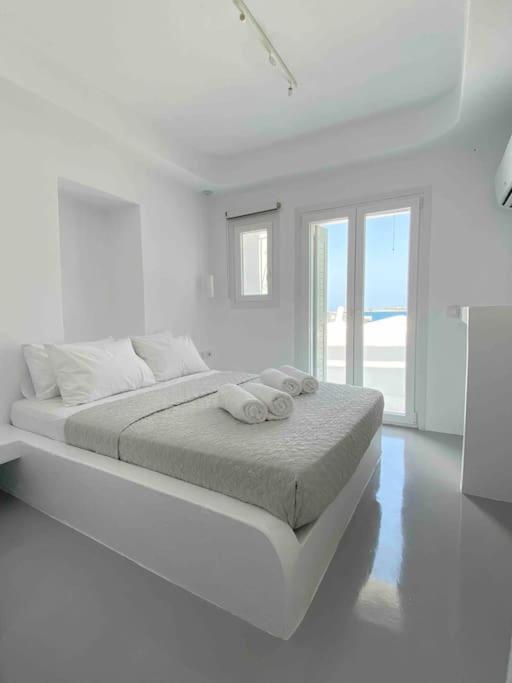 Postel nebo postele na pokoji v ubytování 31 Seafront Apartment