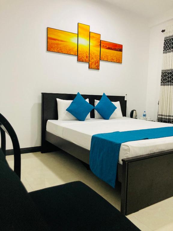 Postel nebo postele na pokoji v ubytování White Land City Hotel
