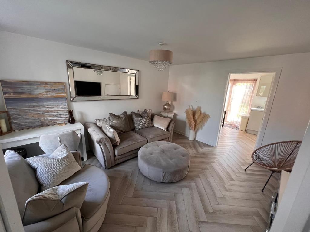 a living room with a couch and a table at Durham Homestay in Sacriston