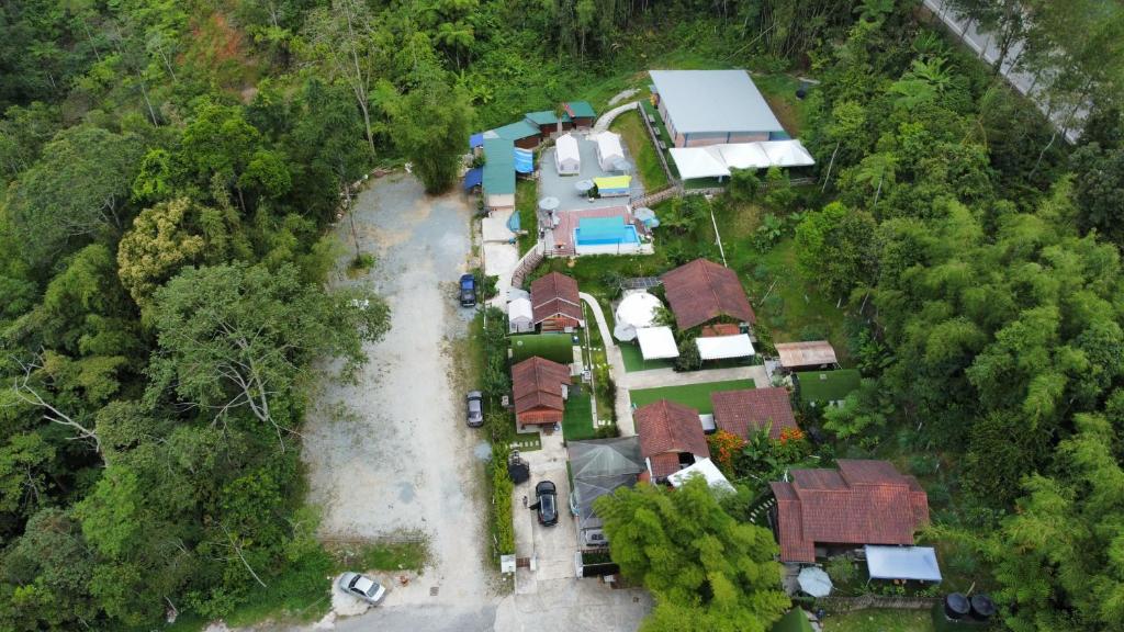 an overhead view of a house in the forest at Genting Greenwoods Tiny Houses & Events Hall in Genting Highlands