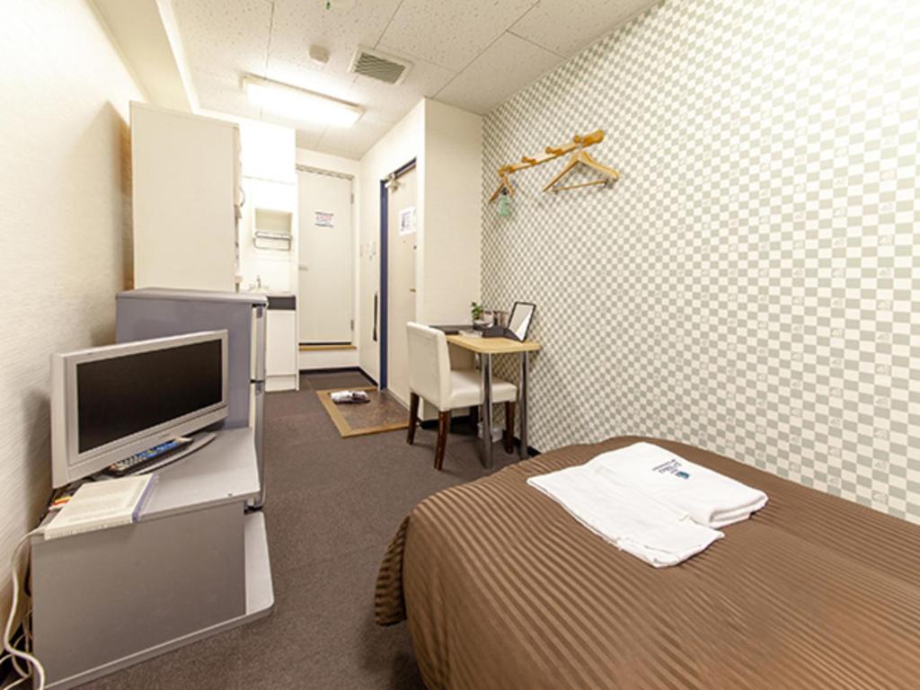 TV a/nebo společenská místnost v ubytování HOTEL LiVEMAX BUDGET Nippori
