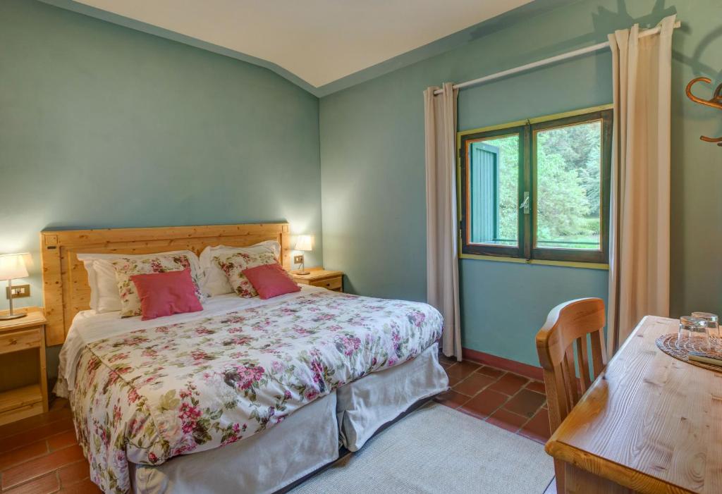 Postel nebo postele na pokoji v ubytování Albergo Villa San Michele