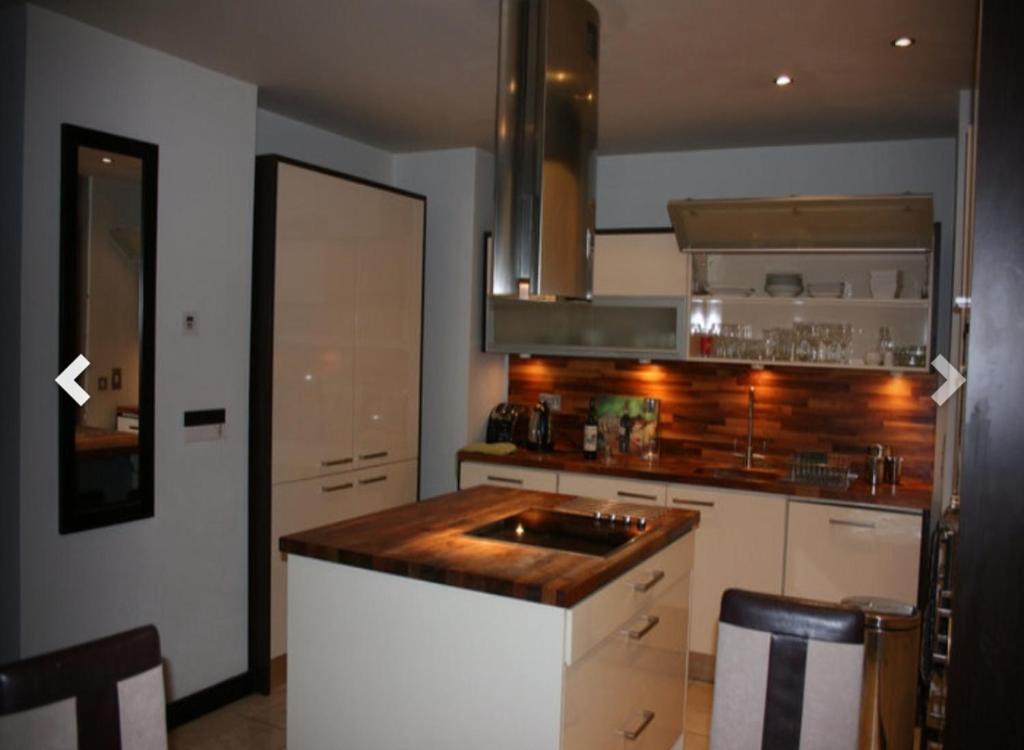 a kitchen with a sink and a counter top at 2 Bed Apartment in Sandyford