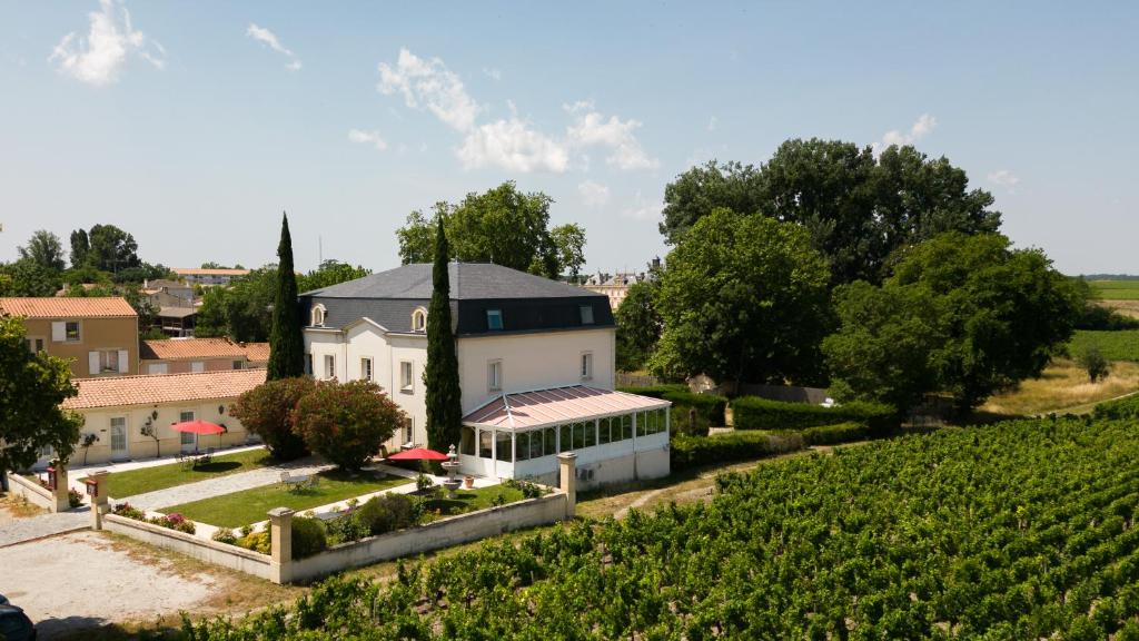 an aerial view of a house in a vineyard at Hôtel de Margaux in Margaux