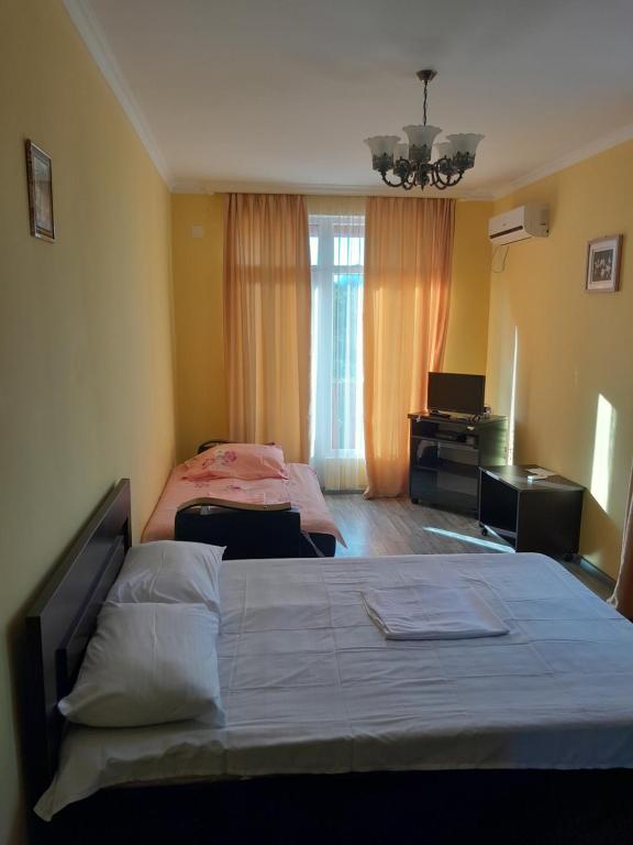 En eller flere senge i et værelse på Zau Vila