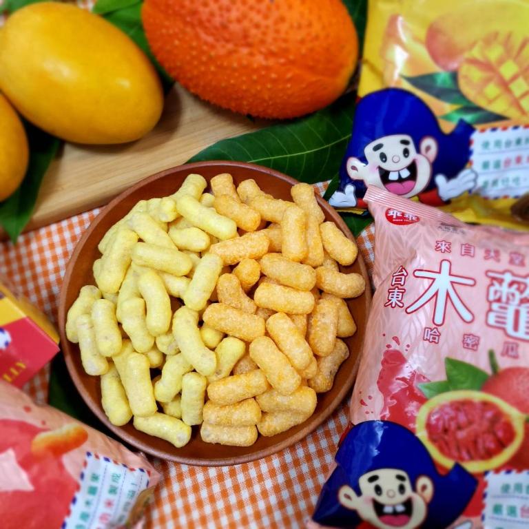 a bowl of french fries on a table with fruit at Sun B&amp;B in Taitung City