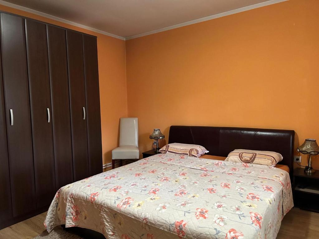 a bedroom with a bed and a dresser at Nena in Veliko Gradište