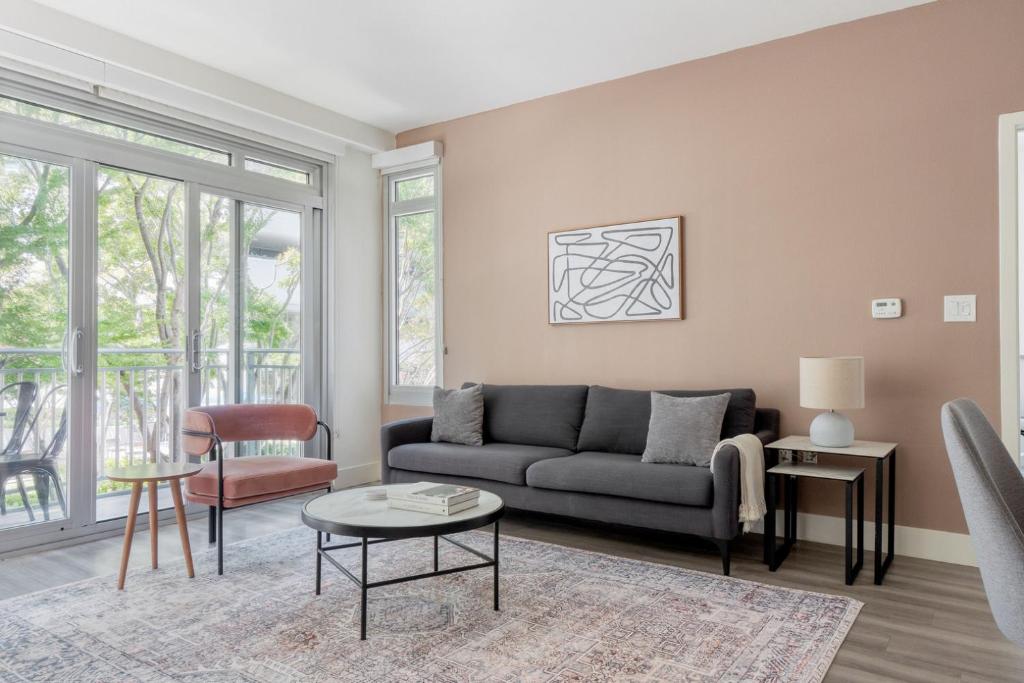 a living room with a couch and a table at Mountain View 2br w bbq lounge roof nr shops SFO-1417 in Los Altos