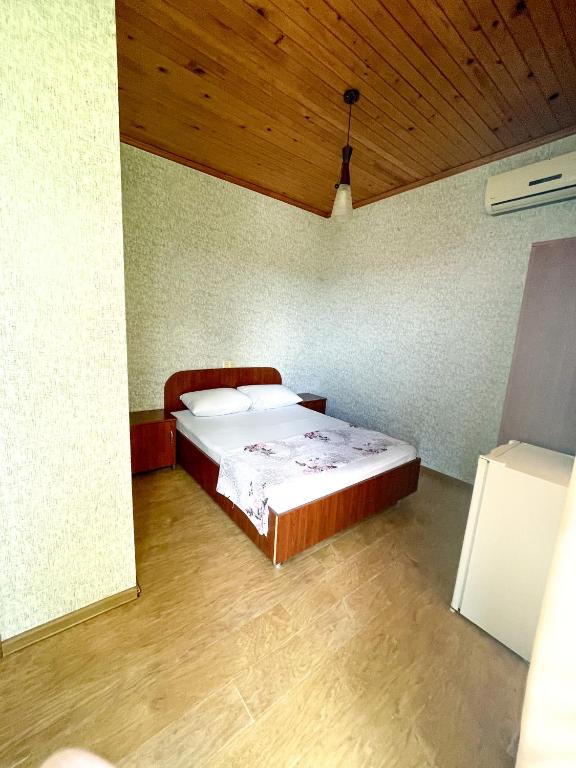 Postel nebo postele na pokoji v ubytování Hotel "Qeti"