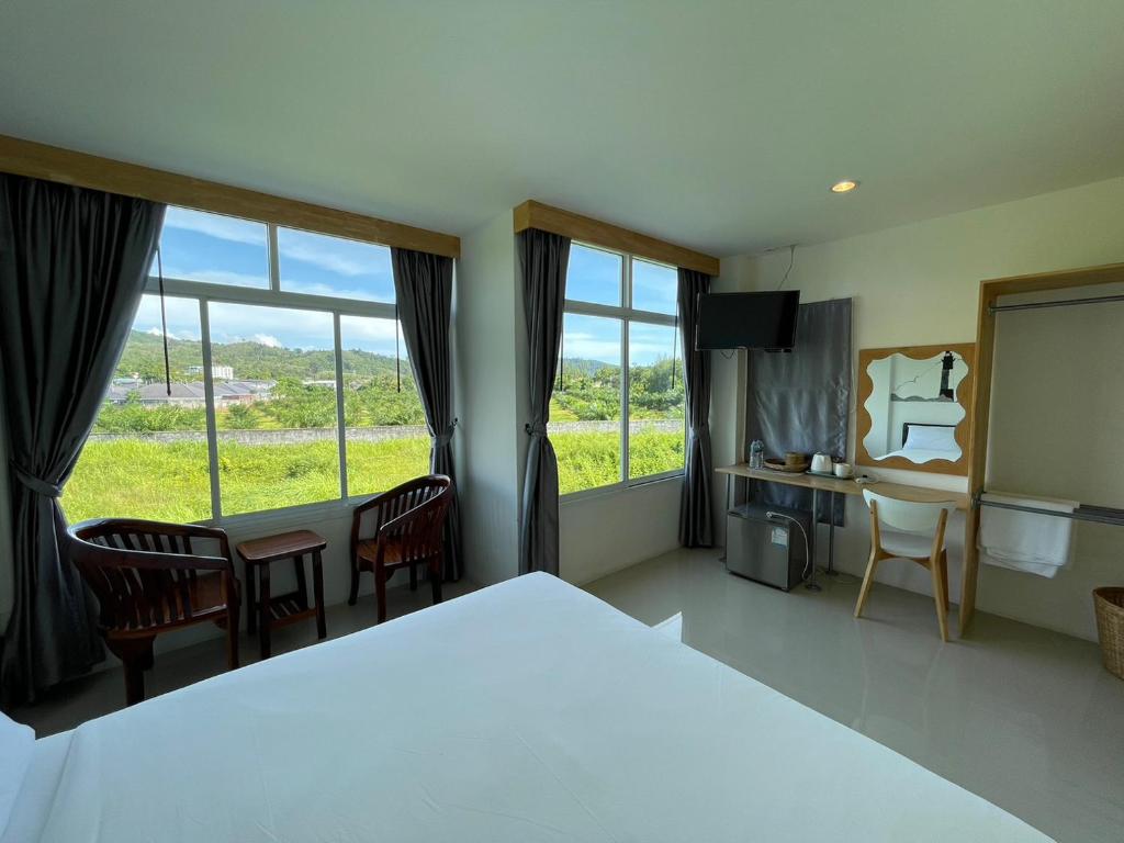 Dwell Phuket Airport Hotel at Naiyangにあるベッド