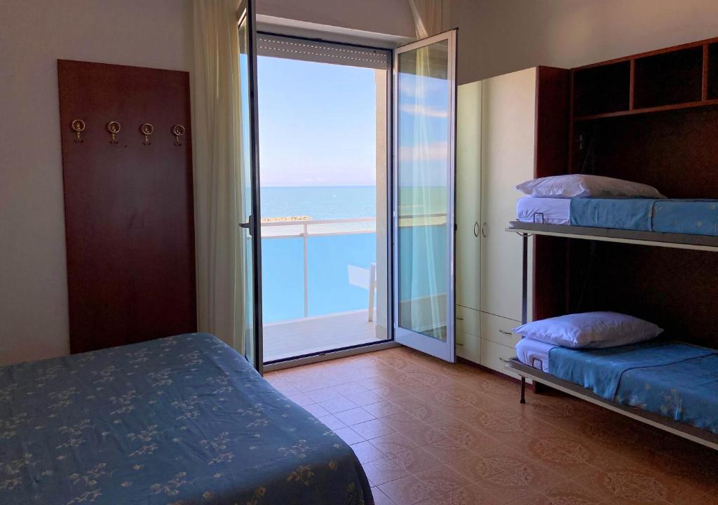 Кровать или кровати в номере Hotel Sayonara