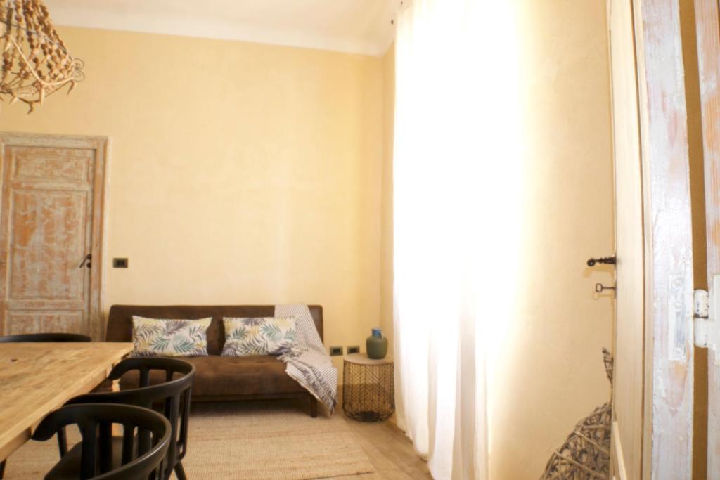 A bed or beds in a room at Ai due Mori Apt by Addler House Ospitality
