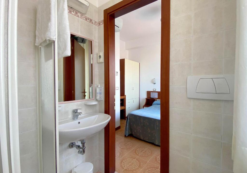 Кровать или кровати в номере Hotel Sayonara